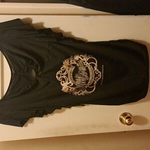 Bat wing black and gold dress but could also be a top